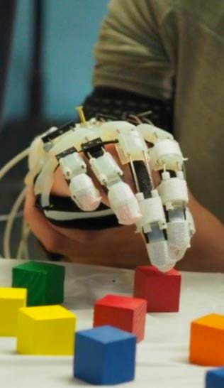 A hand moving blocks while being stabilized a hand covering