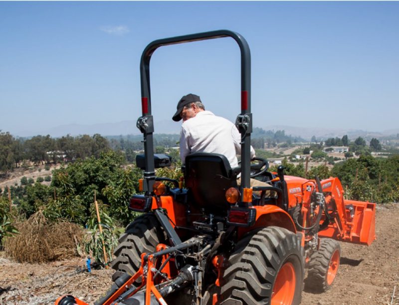 A man riding tractor