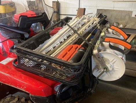 2b. A front-mounted rack on a four-wheeler aids in carrying posts, reels, and other temporary fencing tools.