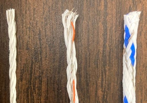  A close-up of three types of wiring, with the smallest diameter at the left and increasing in size.